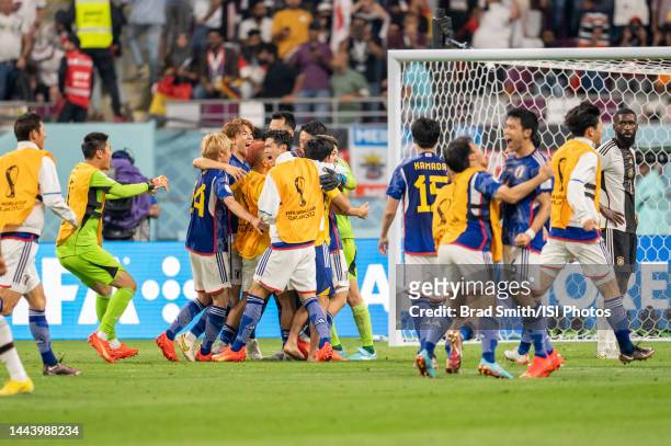 Japan celebrates during a FIFA World Cup Qatar 2022 Group E match between Japan and Germany at Khalifa International Stadium on November 23, 2022 in...