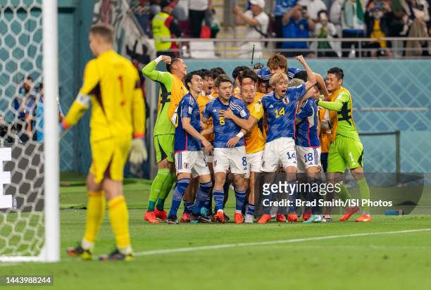 Japan celebrates a goal during a FIFA World Cup Qatar 2022 Group E match between Japan and Germany at Khalifa International Stadium on November 23,...
