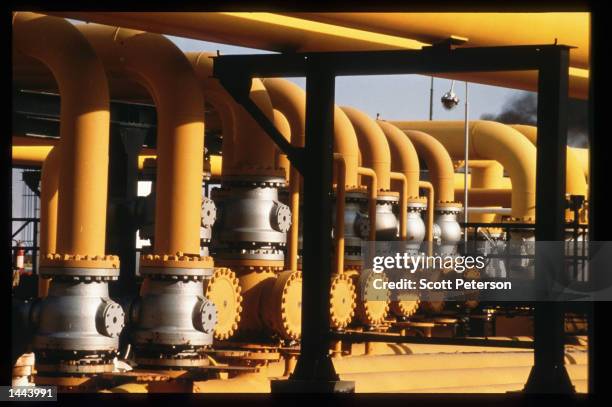 Pipes carry oil at the southern complex refinery June 15, 1997 in Hassi Messaoud, Algeria. The recent completion of a multi-billion dollar oil...