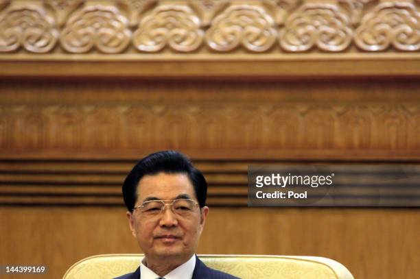Chinese President Hu Jintao holds a meeting with his South Korean counterpart Lee Myung-bak and Japan's Prime Minister Yoshihiko Noda during the...