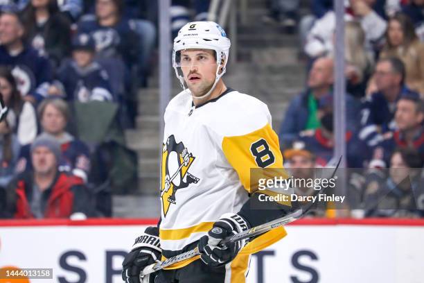 Brian Dumoulin of the Pittsburgh Penguins looks on during a third period stoppage in play against the Winnipeg Jets at the Canada Life Centre on...