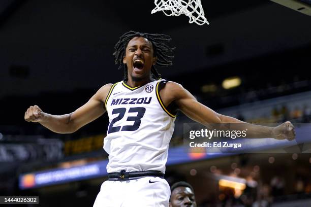 Aidan Shaw of the Missouri Tigers celebrates a dunk against the Coastal Carolina Chanticleers in the second half at Mizzou Arena on November 23, 2022...