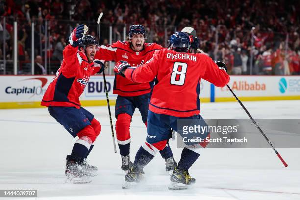 Alex Ovechkin of the Washington Capitals celebrates with teammates after scoring the winning goal during the overtime period of the game against the...
