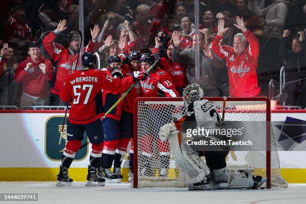 Sonny Milano of the Washington Capitals celebrates with teammates after scoring a goal against Felix Sandstrom of the Philadelphia Flyers during the...