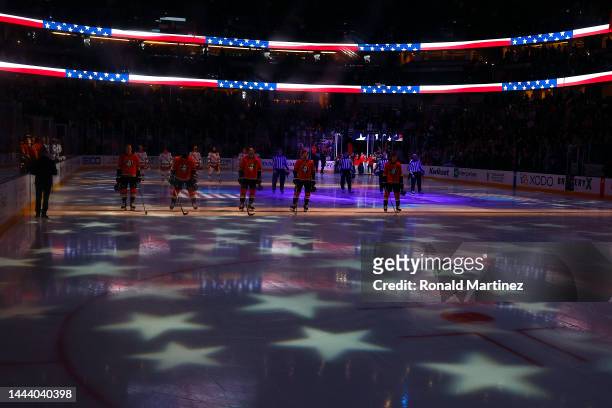 The Anaheim Ducks during the national anthem before a game against the New York Rangers at Honda Center on November 23, 2022 in Anaheim, California.