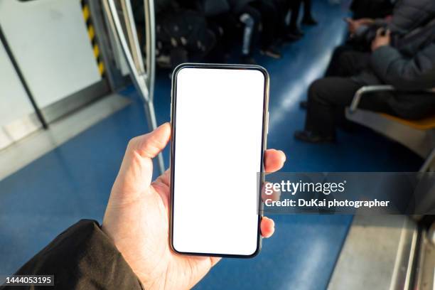 use smartphone 5g in the subway. china - point-of-view stock pictures, royalty-free photos & images
