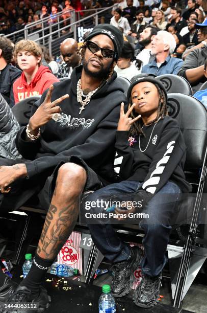 Rapper 2 Chainz and his son Halo Epps attend the game between the Sacramento Kings and the Atlanta Hawks at State Farm Arena on November 23, 2022 in...