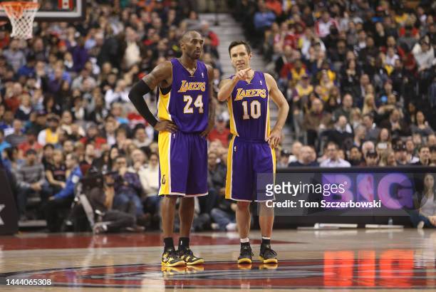 Steve Nash of the Los Angeles Lakers talks to Kobe Bryant against the Toronto Raptors during NBA game action on January 20, 2013 at Air Canada Centre...