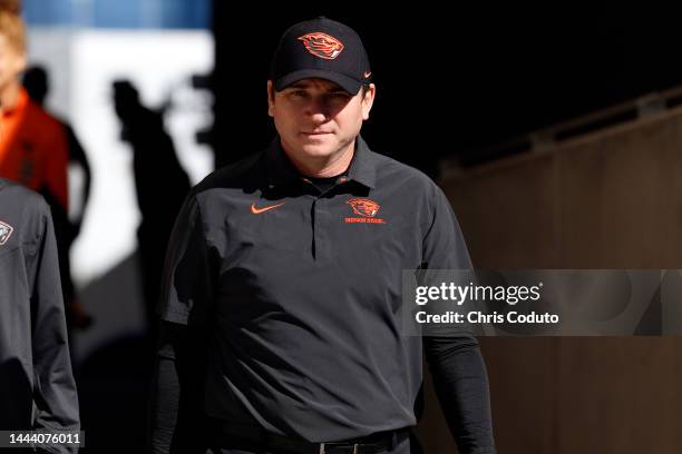 Head coach Jonathan Smith of the Oregon State Beavers walks to the field before the game against the Arizona State Sun Devils at Sun Devil Stadium on...