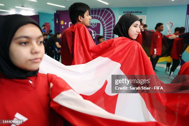 Flag bearers wait in the tunnel before the FIFA World Cup Qatar 2022 Group F match between Belgium and Canada at Ahmad Bin Ali Stadium on November...