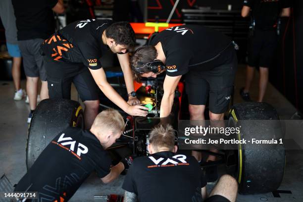 Van Amersfoort Racing engineers work on the car during Formula 2 testing at Yas Marina Circuit on November 24, 2022 in Abu Dhabi, United Arab...