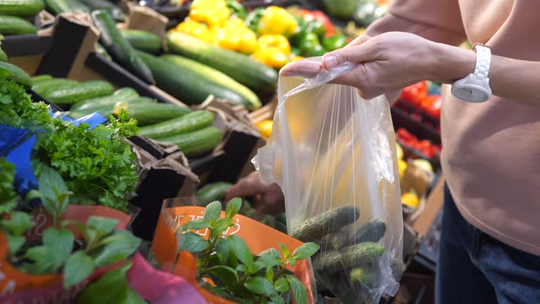https://media.gettyimages.com/id/1444102364/video/close-up-of-hands-packing-dried-cucumbers-to-the-plastic-bag-shopping-freshest-produce-at-a.jpg?b=1&s=640x640&k=20&c=5qFSwWn9pDxMehjIEx9p4fZ8gRyb5FRvEtFqm5zAXM8=