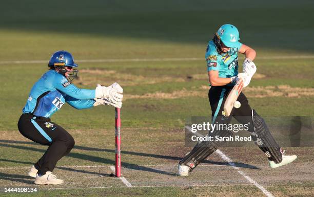 Amelia Kerr of the Brisbane Heat and Tegan McPharlin of the Adelaide Strikers during the Women's Big Bash League match between the Adelaide Strikers...