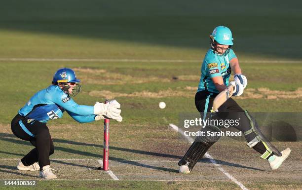 Georgia Voll of the Brisbane Heat and Tegan McPharlin of the Adelaide Strikers during the Women's Big Bash League match between the Adelaide Strikers...