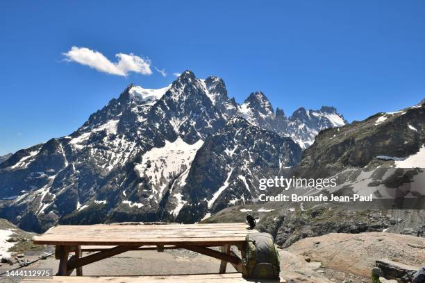 picnic table in front of the massif of the meige seen from the refuge - ecrin national park stock pictures, royalty-free photos & images