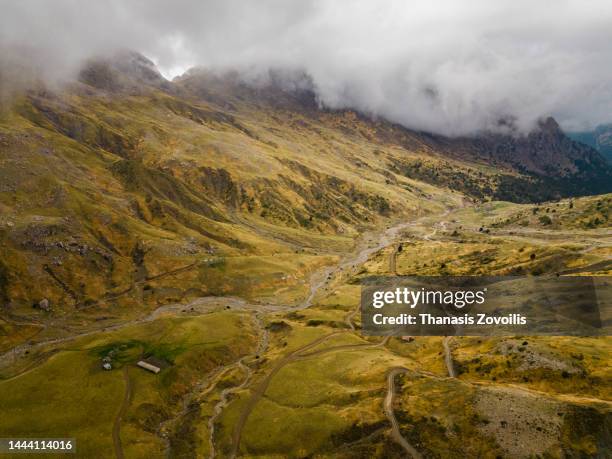 aerial shots of mountains with mist and clouds near olympos, greece - fallen lord stock pictures, royalty-free photos & images