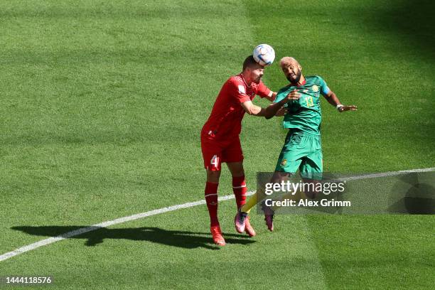 Nico Elvedi of Switzerland competes for a header against Eric Maxim Choupo-Moting of Cameroon during the FIFA World Cup Qatar 2022 Group G match...