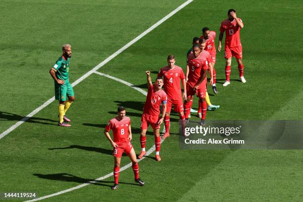 Granit Xhaka of Switzerland gives their team instructions as they prepare to defend a free kick during the FIFA World Cup Qatar 2022 Group G match...