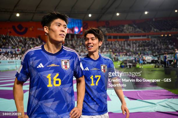 Takehiro Tomiyasu and Ao Tanaka of Japan celebrate their win the FIFA World Cup Qatar 2022 Group E match between Germany and Japan at Khalifa...