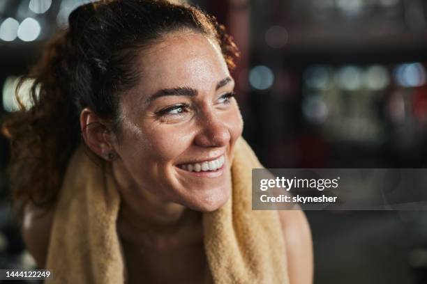 sweaty athletic woman with towel in a gym. - svett bildbanksfoton och bilder