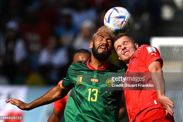 Eric Maxim Choupo-Moting of Cameroon and Nico Elvedi of Switzerland compete for the ball during the FIFA World Cup Qatar 2022 Group G match between...