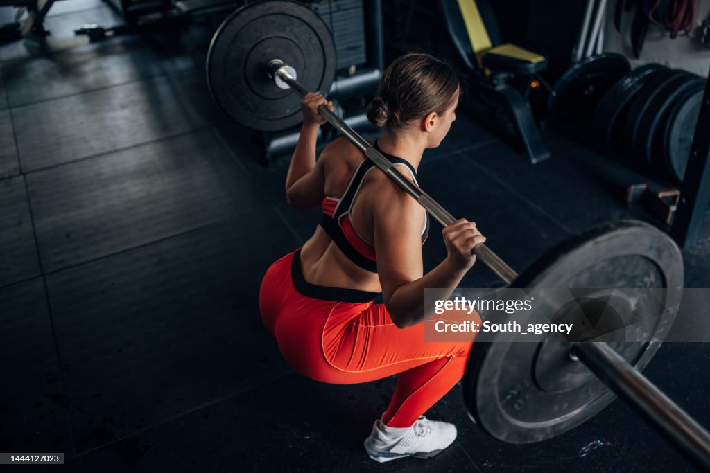 Fit woman training with weights