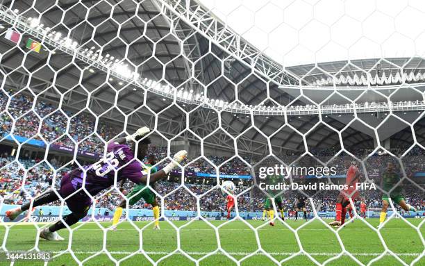 Breel Embolo of Switzerland scores their team's first goal past Andre Onana of Cameroon during the FIFA World Cup Qatar 2022 Group G match between...