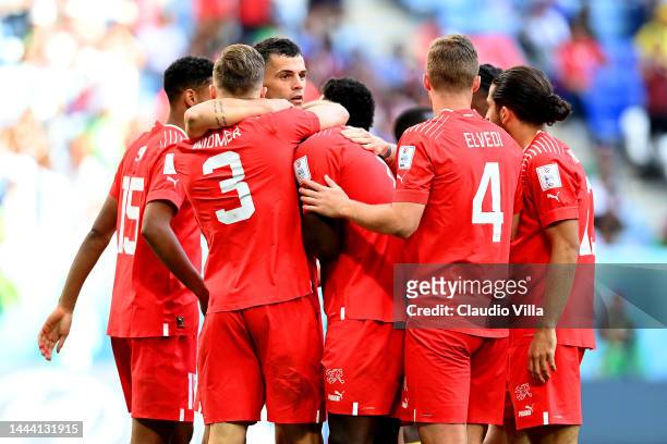 Breel Embolo of Switzerland celebrates scoring their first goal with their teammates during the FIFA World Cup Qatar 2022 Group G match between...
