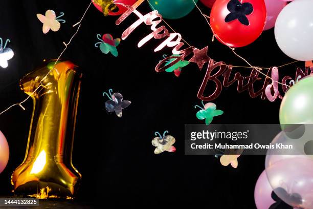 birthday party decorations - birthday candle on black stock pictures, royalty-free photos & images