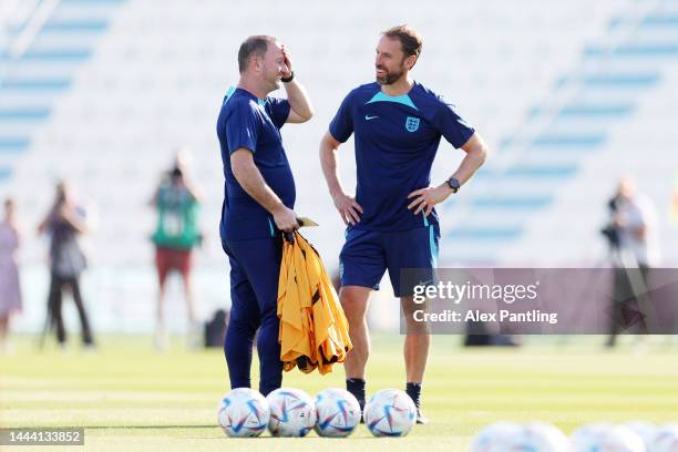 Gareth Southgate , Head Coach of England, speaks with Steve Holland, Assistant Coach of England during the England Training Session at Al Wakrah SC...