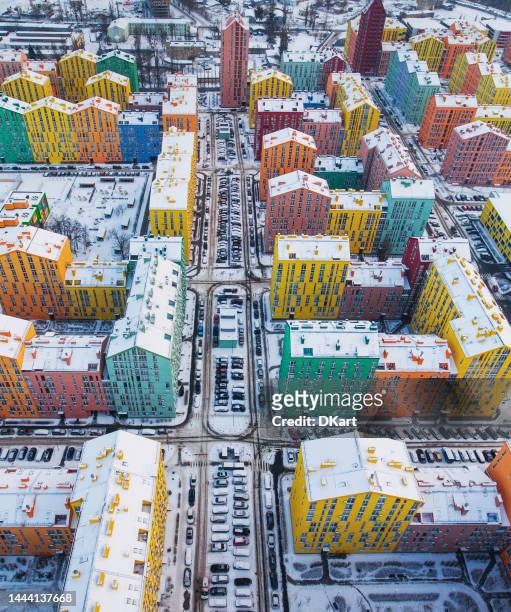 snow-covered colored kyiv residential buildings from the air. - eastern europe stock pictures, royalty-free photos & images