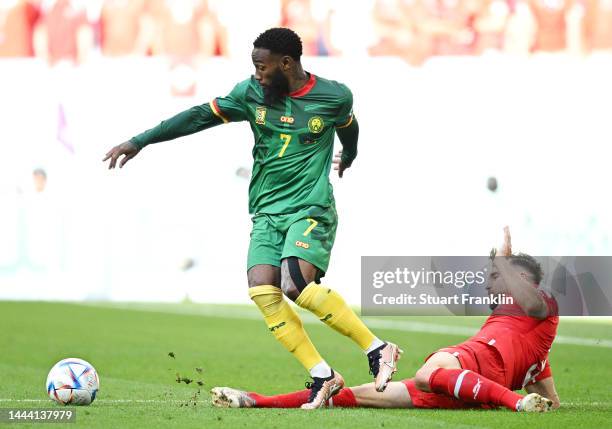 Georges-Kevin Nkoudou of Cameroon controls the ball against Silvan Widmer of Switzerland during the FIFA World Cup Qatar 2022 Group G match between...