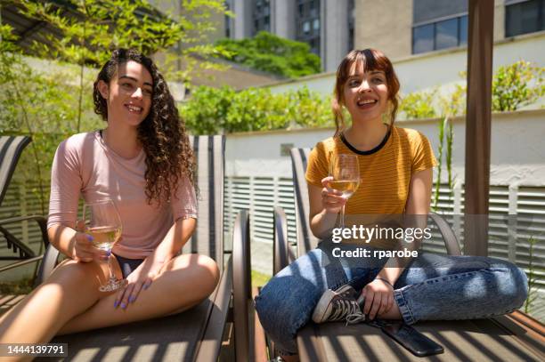 women sunbathing - compras online stock pictures, royalty-free photos & images