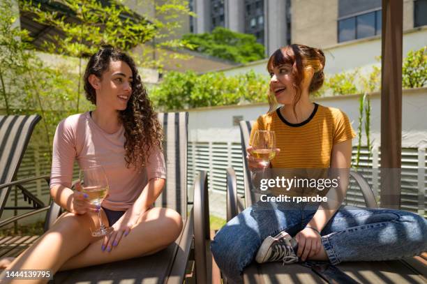 women sunbathing - compras online stock pictures, royalty-free photos & images