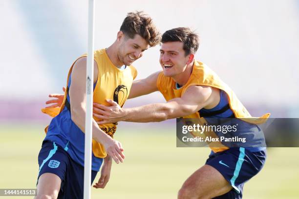 John Stones and Harry Maguire of England train during the England Training Session at Al Wakrah SC Stadium on November 24, 2022 in Doha, Qatar.