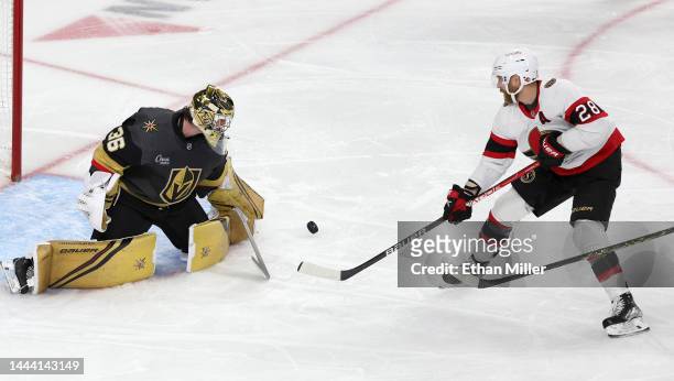 Logan Thompson of the Vegas Golden Knights makes a save against Claude Giroux of the Ottawa Senators in the second period of their game at T-Mobile...