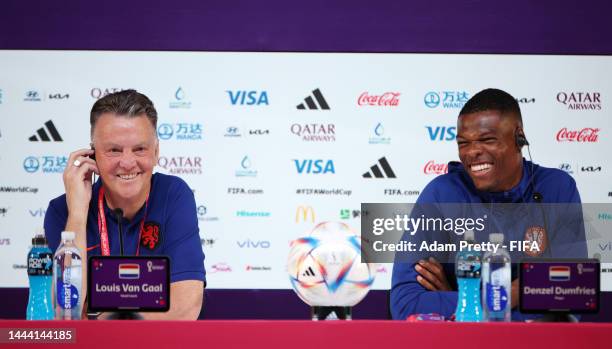 Louis van Gaal, Head Coach of Netherlands, and Denzel Dumfries of Netherlands react during the Netherlands Press Conference at the Main Media Center...