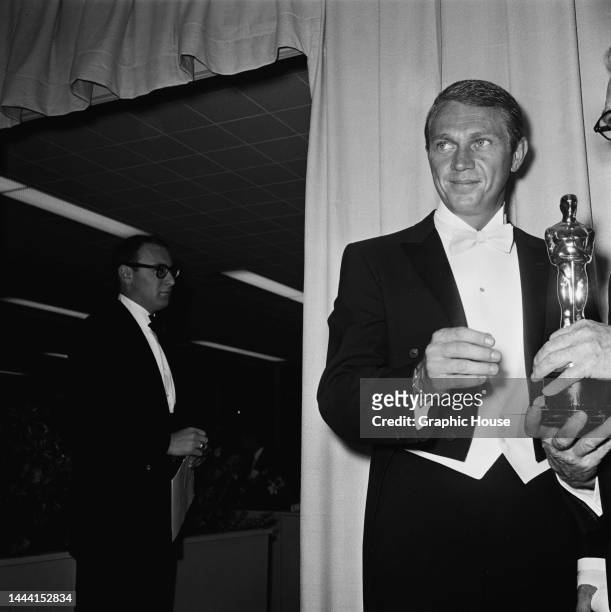 American actor Steve McQueen with the Best Sound award, which he is presenting at the 36th Academy Awards ceremony, held at the Santa Monica Civic...