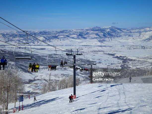 four points ski lift with people, steamboat ski resort colorado. - colorado ski resort stock pictures, royalty-free photos & images