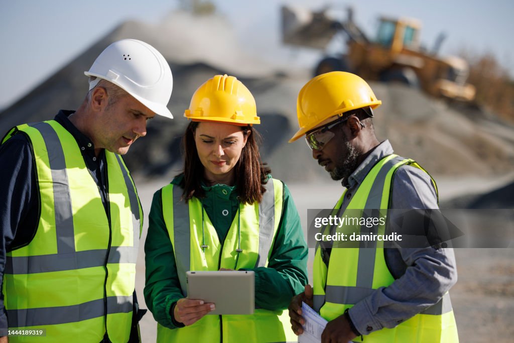 Engineers discussing at building site