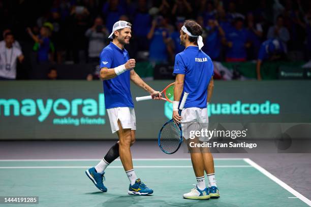 Filippo Volandri, captain of Italy, Simone Bolelli and Fabio Fognini of Italy celebrate after winning Tommy Paul of USA and Jack Sock of USA during...