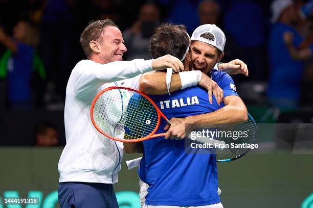 Filippo Volandri, captain of Italy, Simone Bolelli and Fabio Fognini of Italy celebrate after winning Tommy Paul of USA and Jack Sock of USA during...