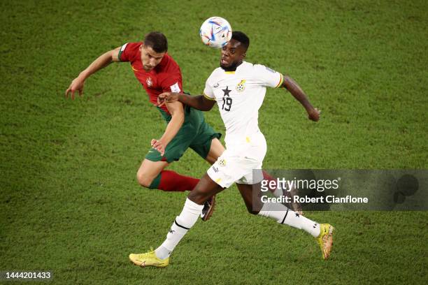 Ruben Dias of Portugal is challenged by Inaki Williams of Ghana during the FIFA World Cup Qatar 2022 Group H match between Portugal and Ghana at...