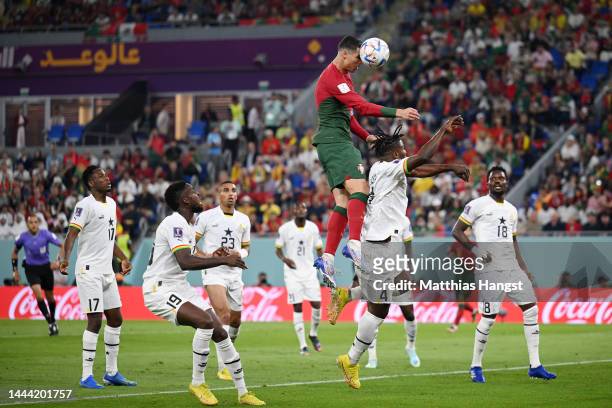 Cristiano Ronaldo of Portugal competes for a header against Mohammed Salisu of Ghana during the FIFA World Cup Qatar 2022 Group H match between...