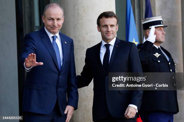 Ireland's Prime Minister Micheal Martin is welcomed by French President Emmanuel Macron upon his arrival at the Elysee presidential Palace before...