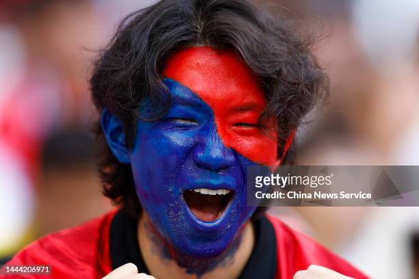 Fan of Korea Republic cheers during the FIFA World Cup Qatar 2022 Group H match between Uruguay and Korea Republic at Education City Stadium on...
