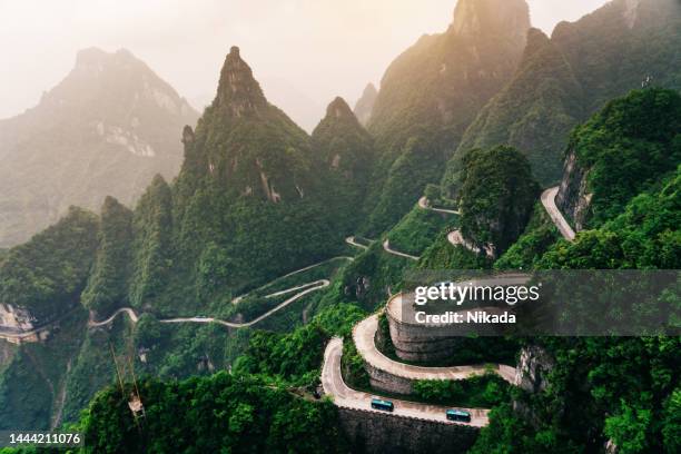 view of winding road of tianmen mountain national park, hunan province, china - urban air vehicle stock pictures, royalty-free photos & images