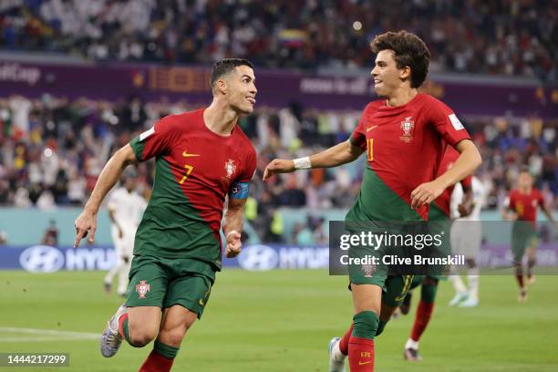 Cristiano Ronaldo of Portugal celebrates with Joao Felix after scoring their team's first goal via a penalty during the FIFA World Cup Qatar 2022...