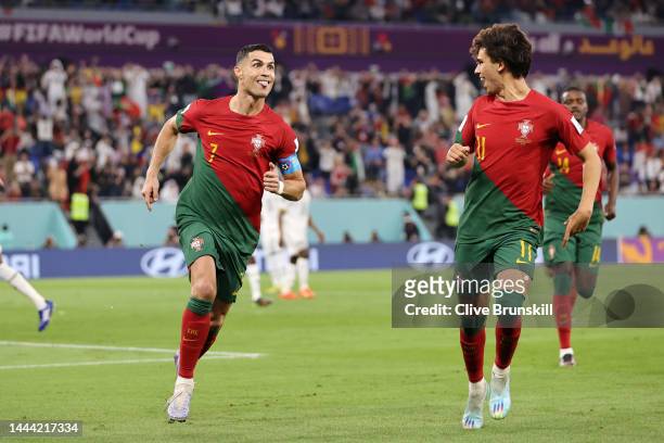 Cristiano Ronaldo of Portugal celebrates with Joao Felix after scoring their team's first goal via a penalty during the FIFA World Cup Qatar 2022...