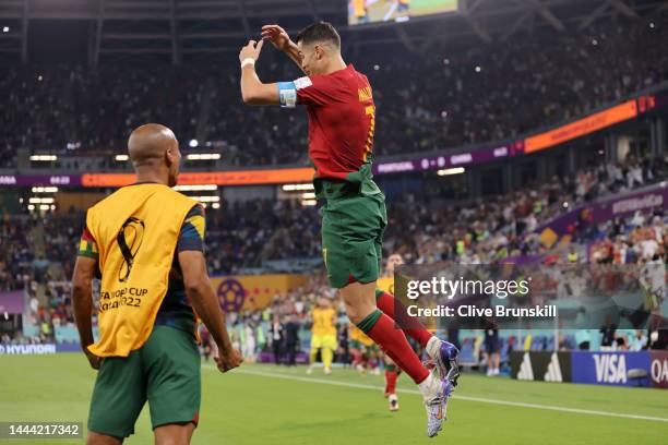 Cristiano Ronaldo of Portugal celebrates after scoring their team's first goal via a penalty during the FIFA World Cup Qatar 2022 Group H match...